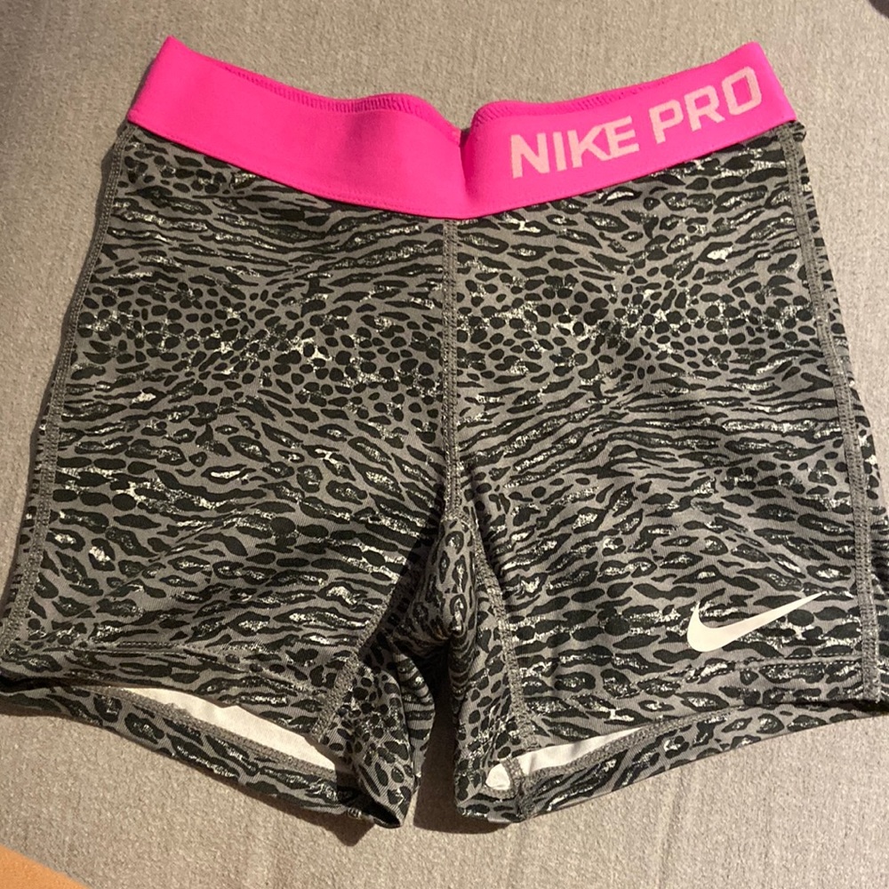 Grey and pink Nike pros. Youth medium
